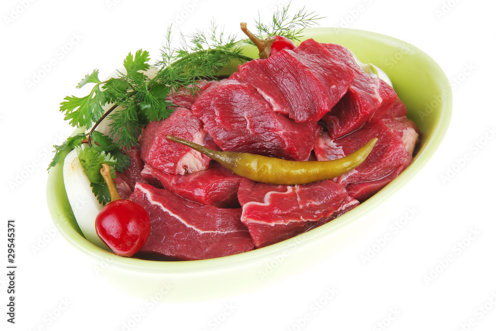 raw fresh beef meat slices in a ceramic dish