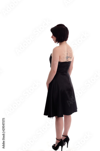 Back of a cute twenties girl in a black dress