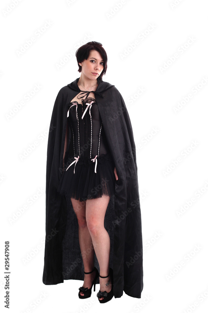 Alternative teen girl in black corset and cloak