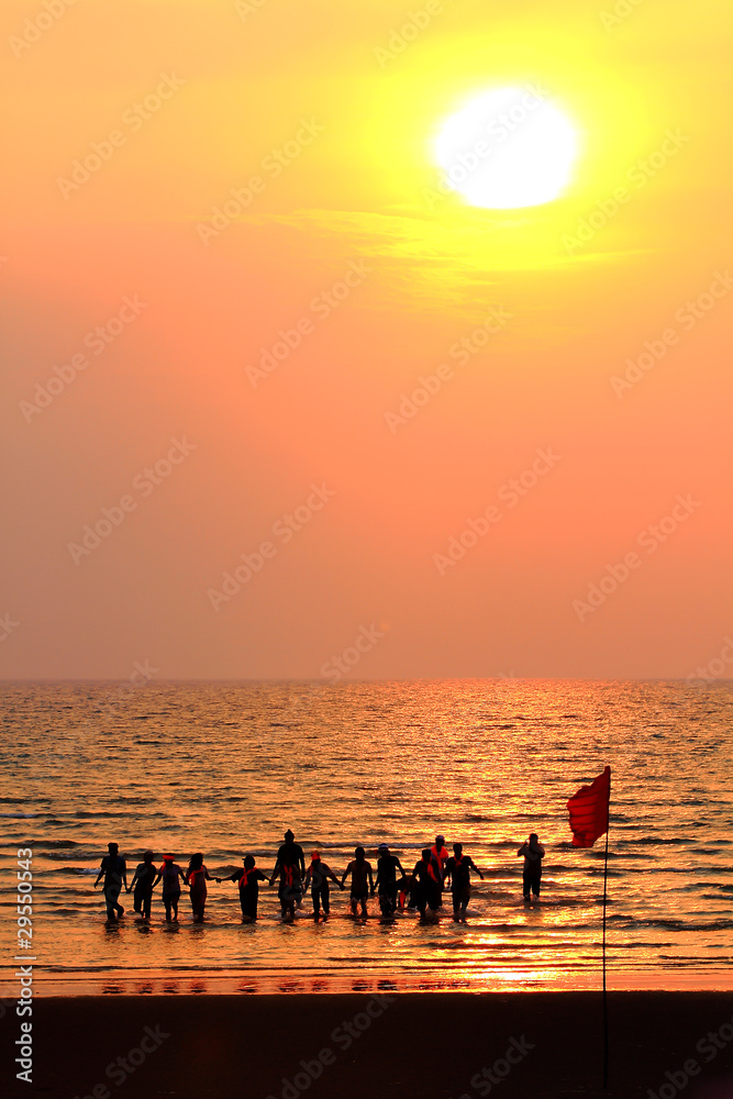 group of people enjoying the sunset