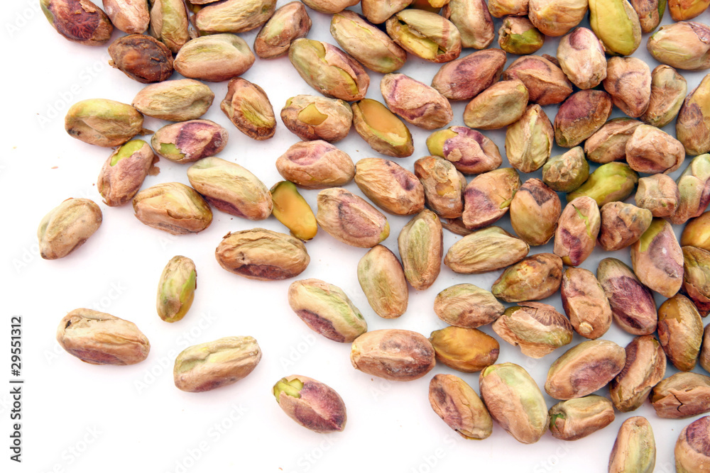 heap of roasted Pistachio isolated on white heap of roasted Pistachio isolated on white