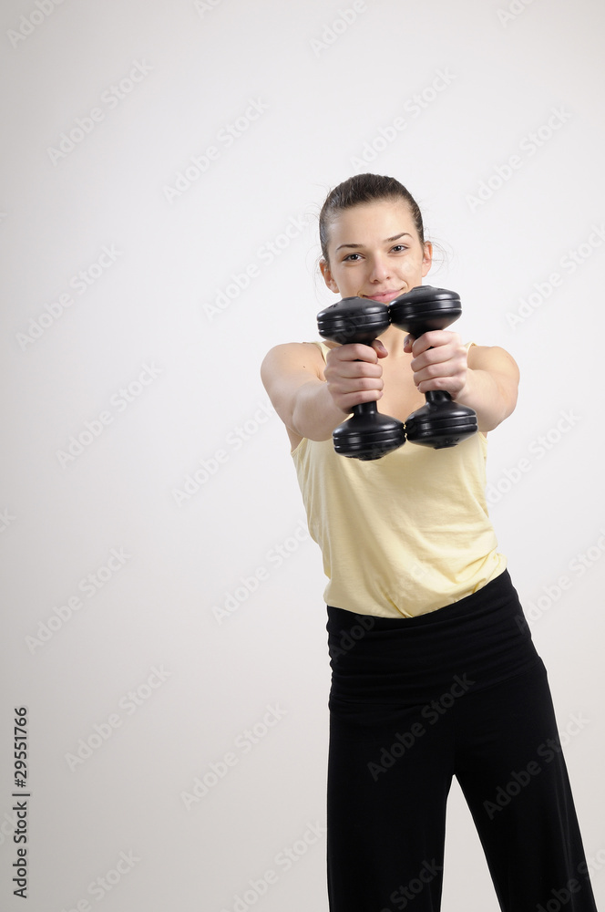 white woman working her muscles with dumbbells white woman working her muscles with dumbbells