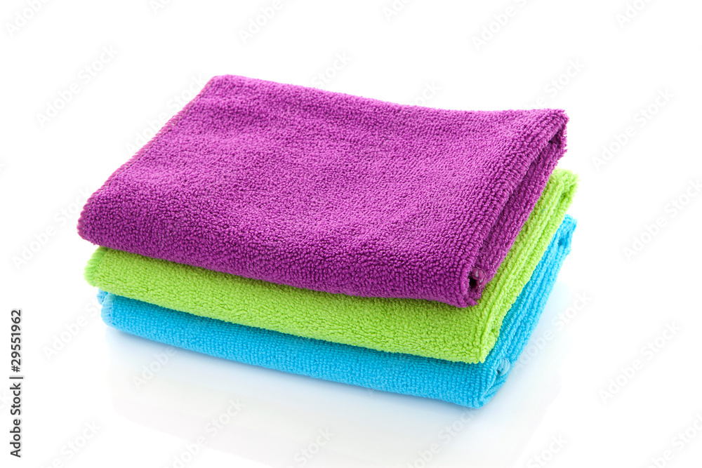 pile of colorful towels over white background pile of colorful towels over white background