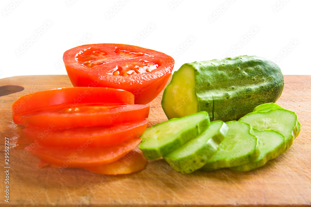 cucumber and tomato slices on a cutting board cucumber and tomato slices on a cutting board
