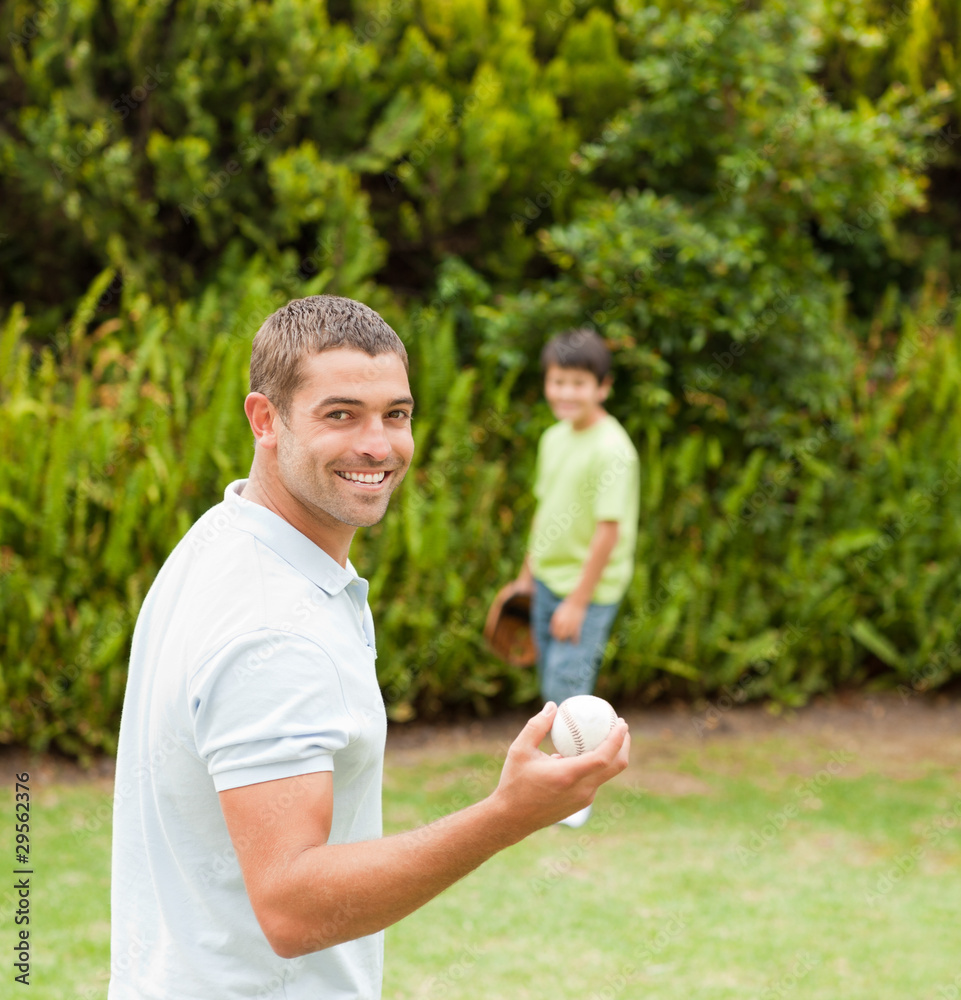 Son playing football with his father Son playing football with his father