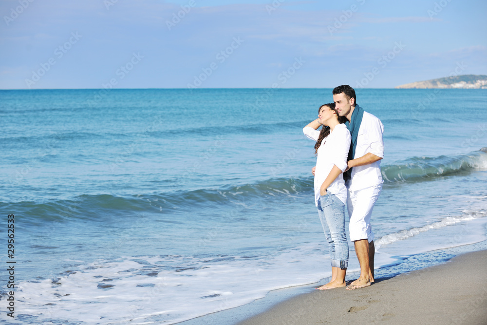 happy young couple have fun at beautiful beach happy young couple have fun at beautiful beach
