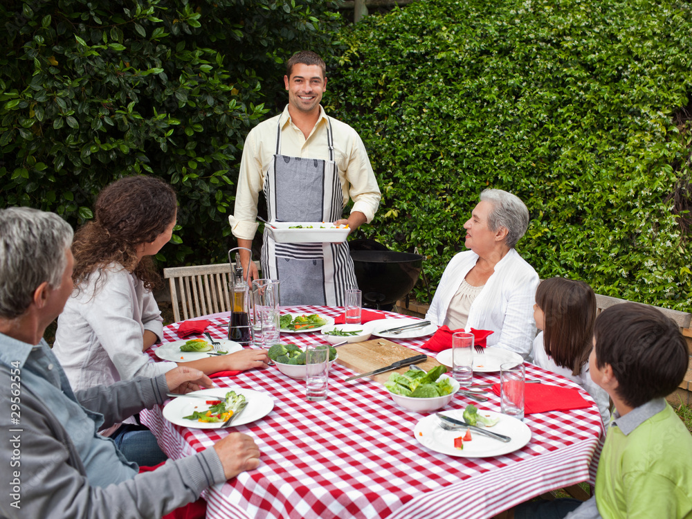 Portrait of a joyful family in the garden Portrait of a joyful family in the garden