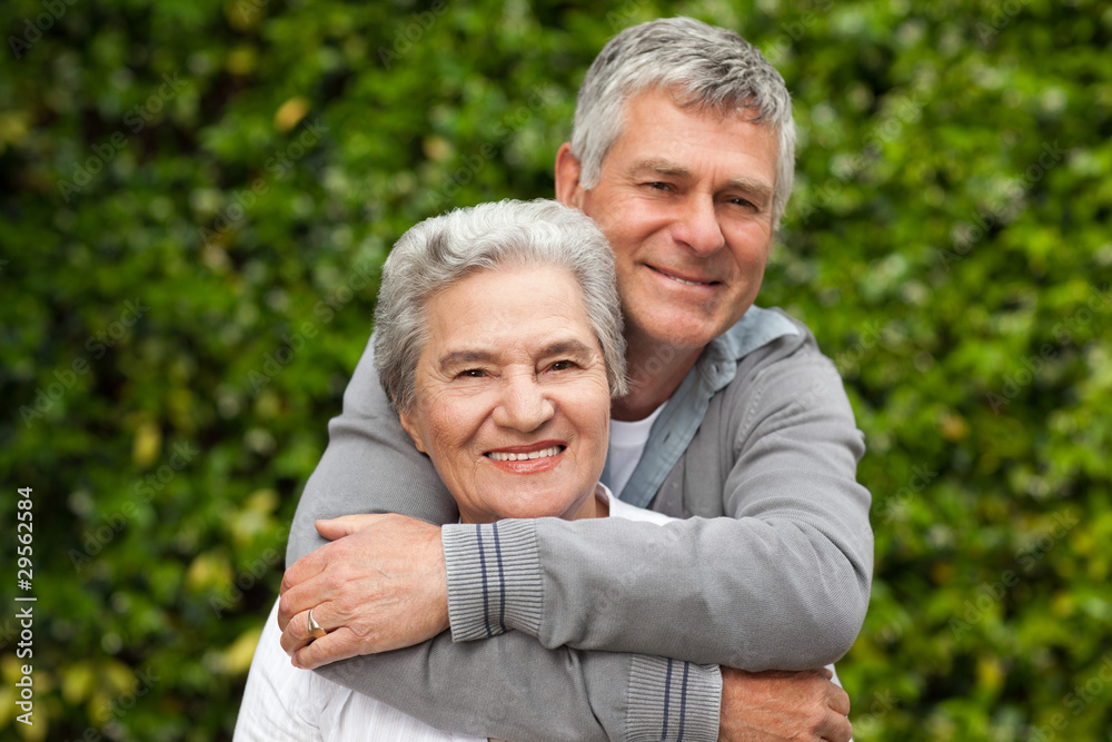 Mature couple hugging in the garden Mature couple hugging in the garden