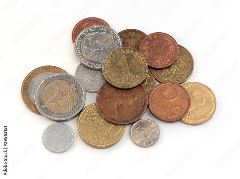 metal coins from different countries on the table metal coins from different countries on the table