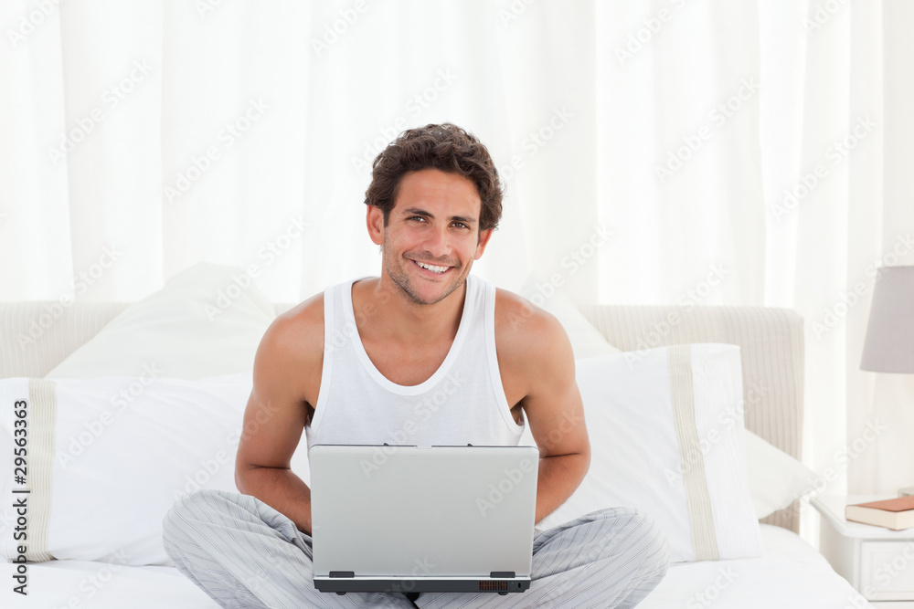 Man working on his laptop at home Man working on his laptop at home