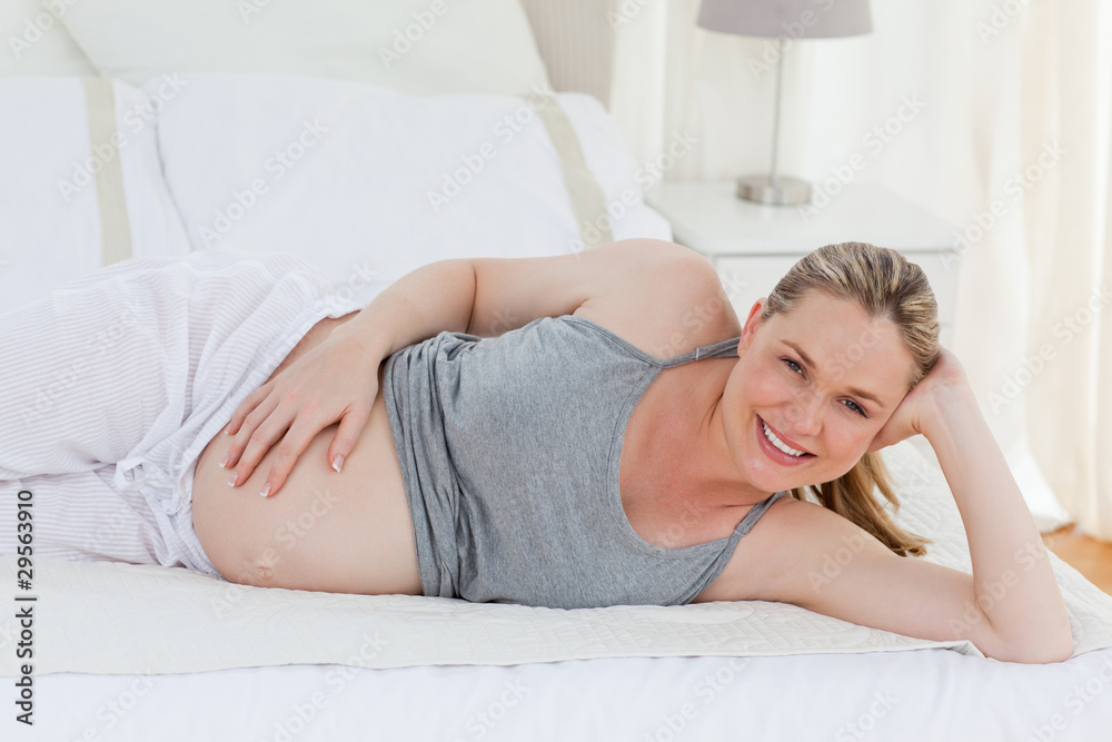Beautiful woman with her hands on her belly