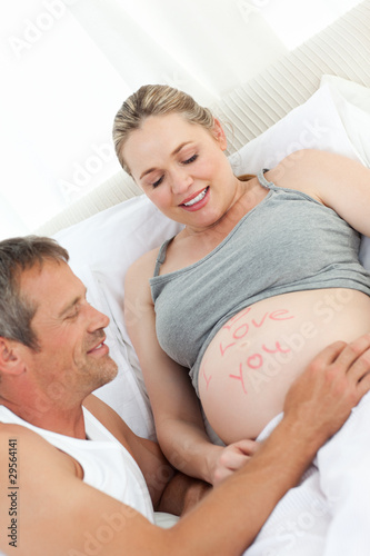 Future father touching his wife's belly