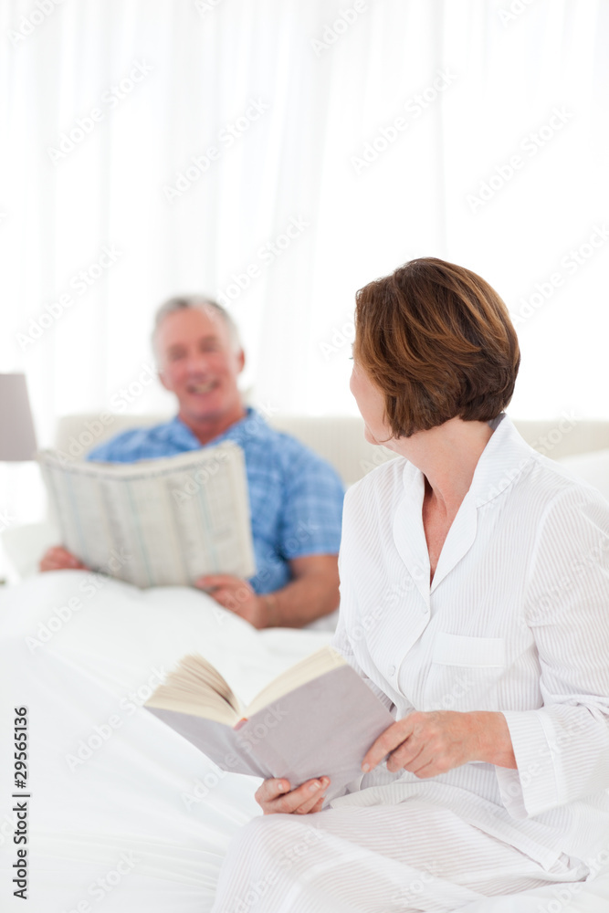 Couple reading together in the bed Couple reading together in the bed