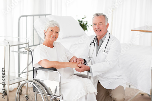 Patient with her doctor looking at the camera