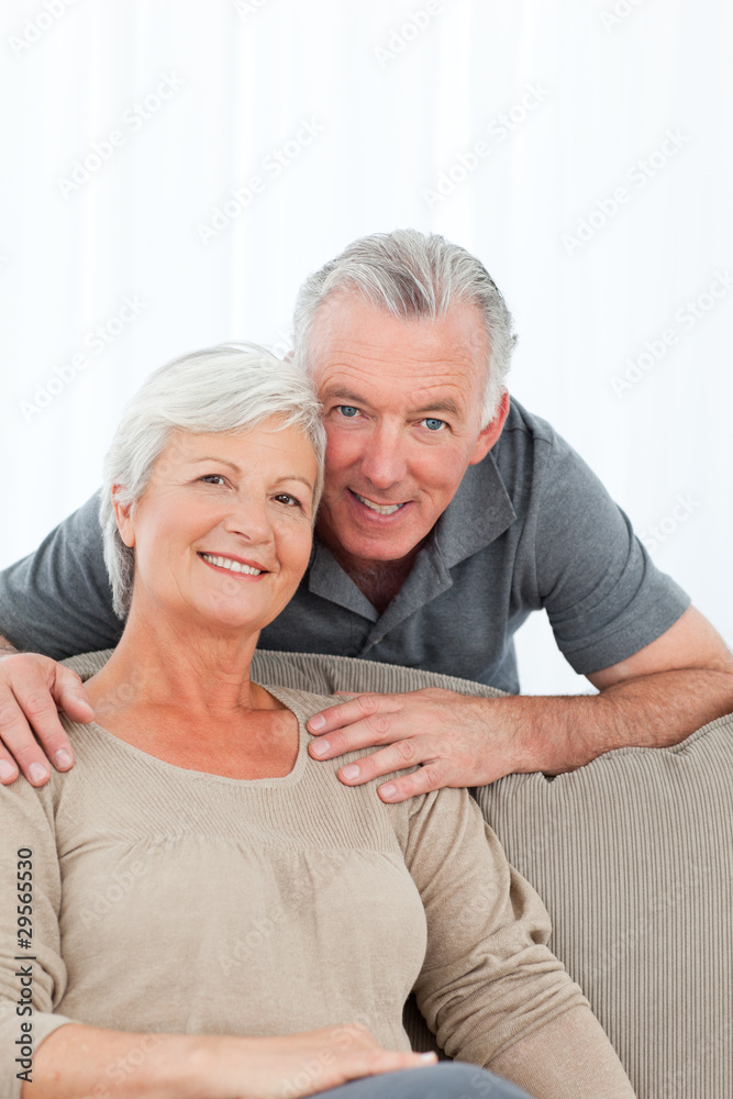 Lovers hugging while they are looking at the camera Lovers hugging while they are looking at the camera