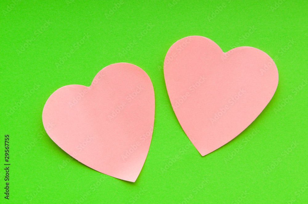 Heart shaped sticky notes on the background Heart shaped sticky notes on the background