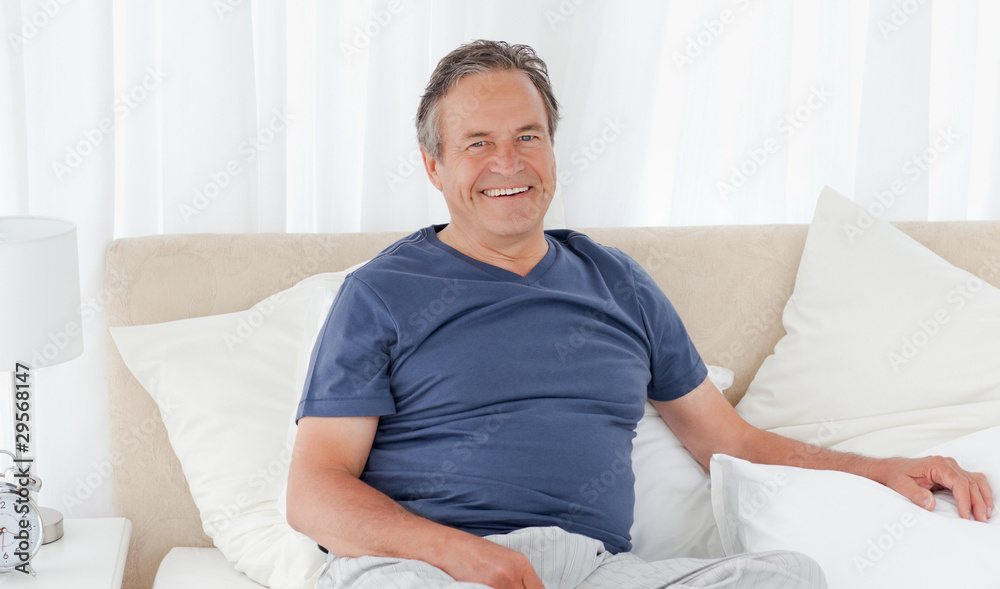 Man lying down on his bed Man lying down on his bed