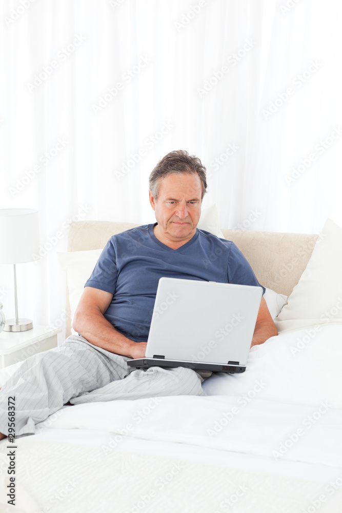 Man looking at his laptop Man looking at his laptop
