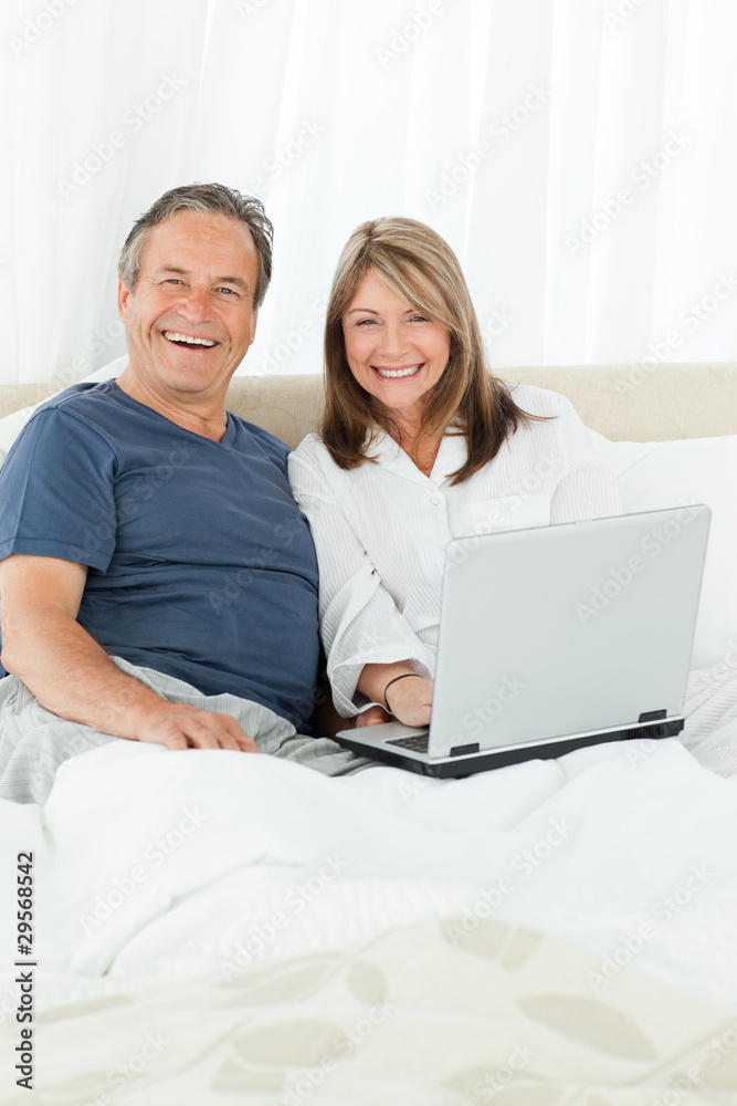 Couple looking at the camera at home Couple looking at the camera at home