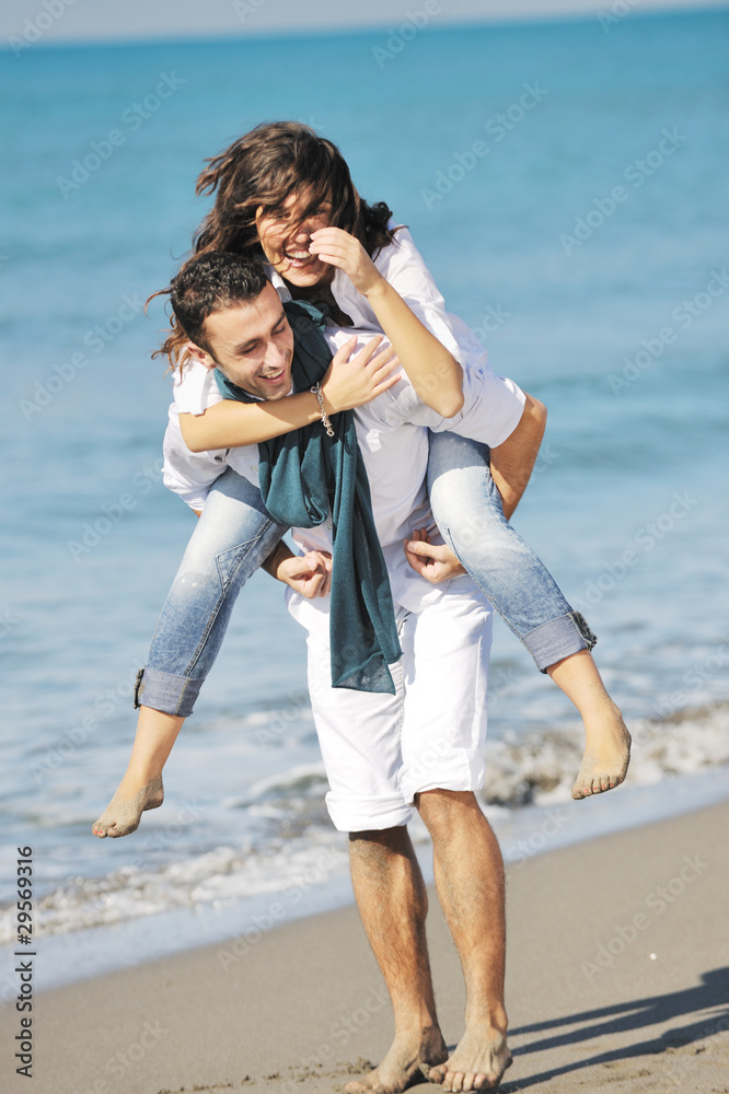 happy young couple have fun at beautiful beach happy young couple have fun at beautiful beach