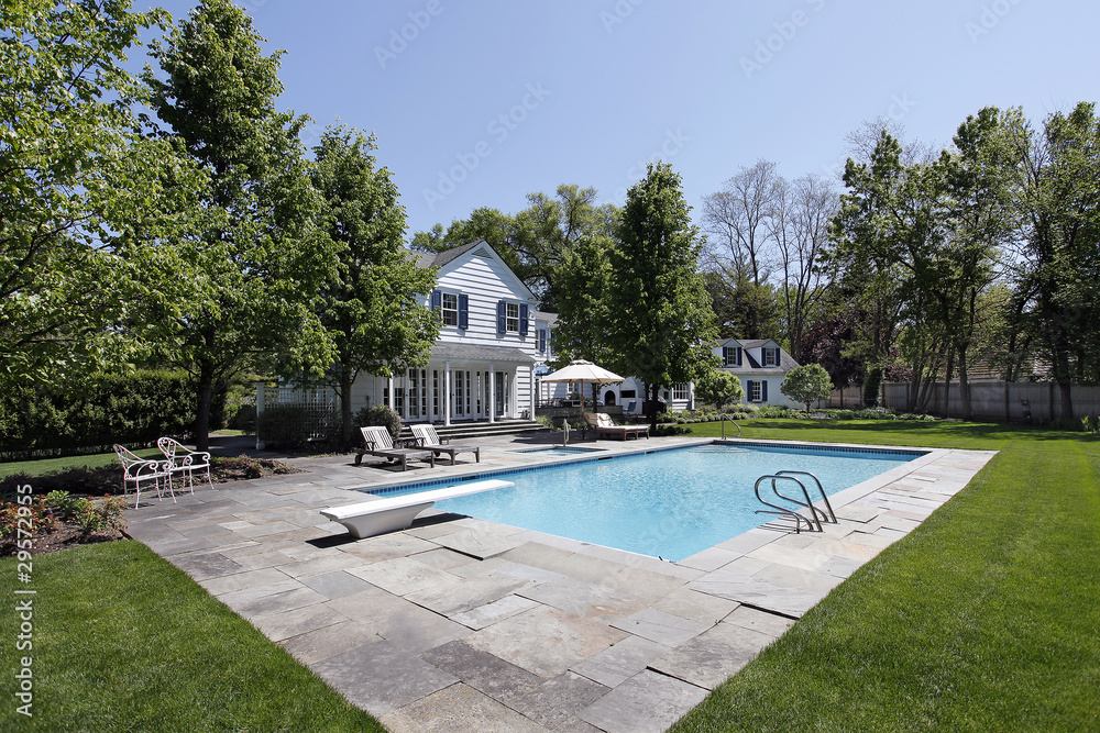 Obraz premium Swimming pool outside luxury home