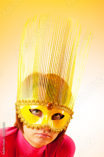 Attractive woman posing in the stylish mask