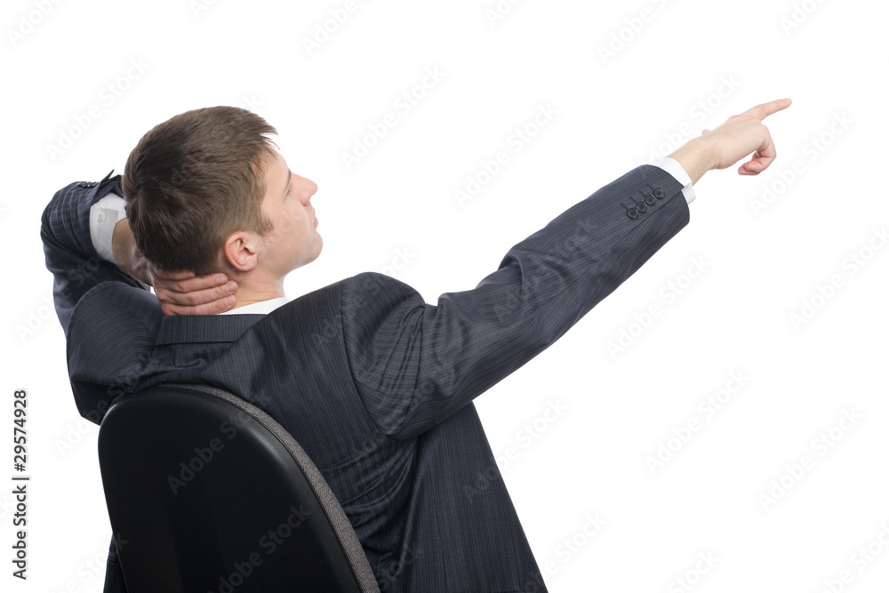 Young businessman shows his hand towards the. Young businessman shows his hand towards the.