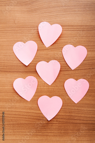 Heart shaped sticky notes on the background