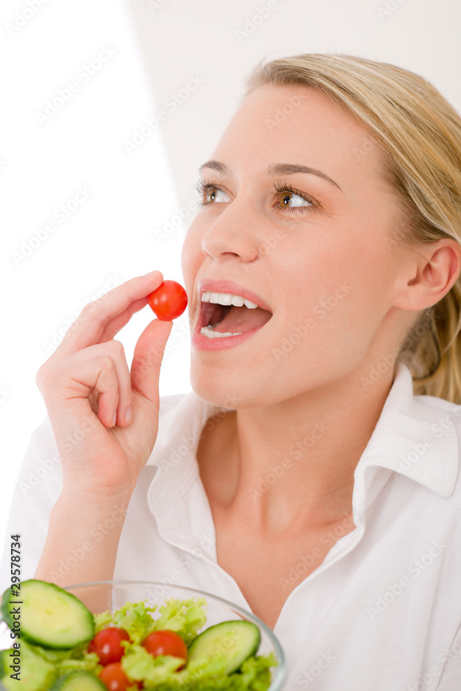 Healthy lifestyle - woman, vegetable salad bite cherry tomato Healthy lifestyle - woman, vegetable salad bite cherry tomato