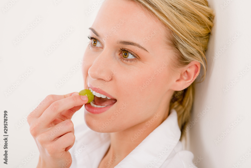 Healthy lifestyle - portrait of woman bite grape Healthy lifestyle - portrait of woman bite grape