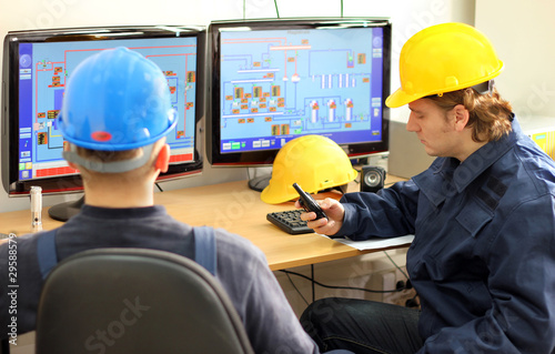 Two Workers in a Control room photo