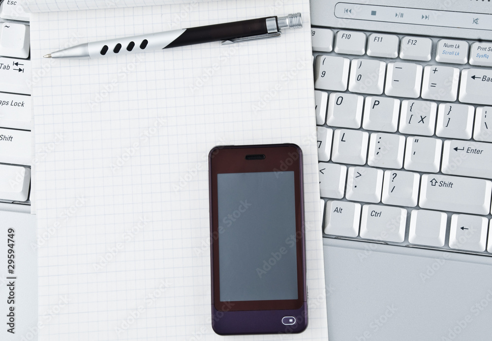 Laptop with Hi-Tech mobile phone and notepad. Laptop with Hi-Tech mobile phone and notepad.