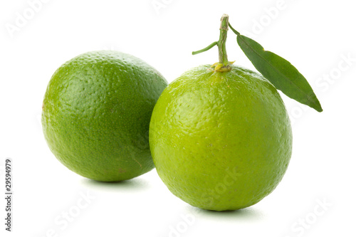 Two ripe limes with leaf