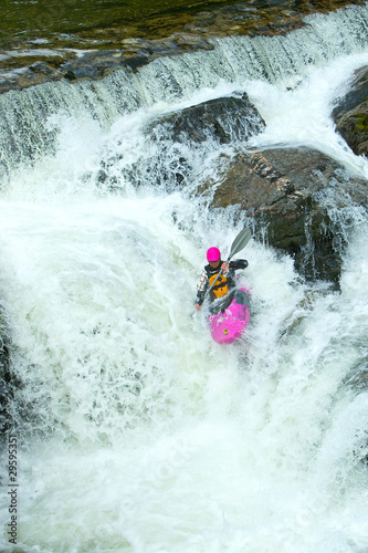 Kayaker on the waterfall in Norway