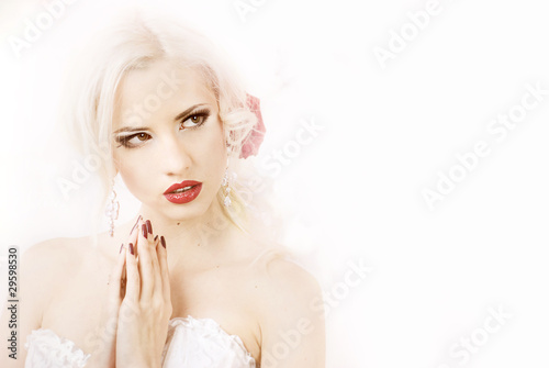 Tender beauty portrait of bride with roses wreath in hair
