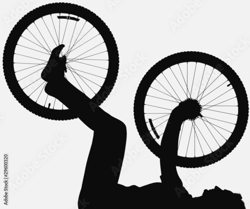 Silhouette Of Person Holding Bicycle Wheels