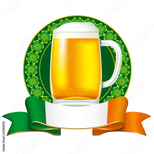 A mug of beer with Irish flag and clover ornament.