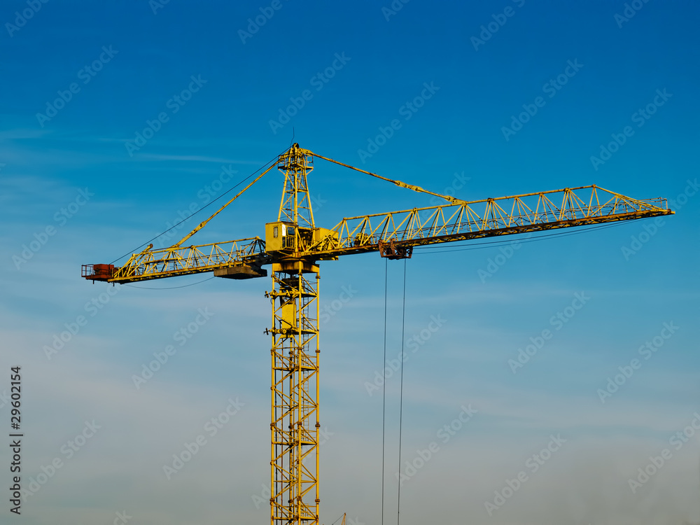 high building crane against the blue sky background