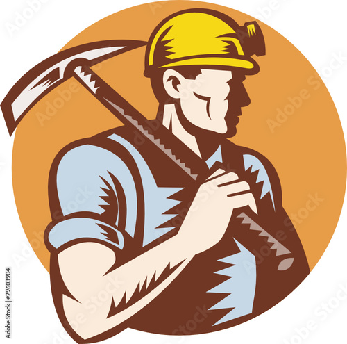 Coal miner at work with pick ax photo