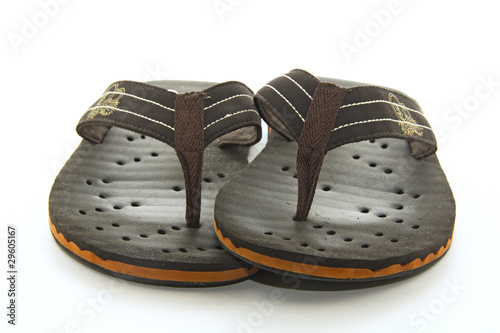 Brown flip flops on a white background photo