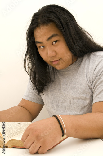 Bild auf Leinwand Asian Male Studying