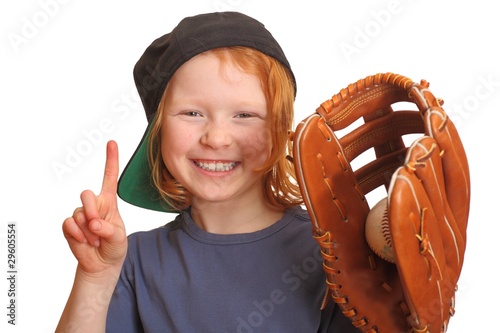 Portrait of a funny red haired girl with baseball cap