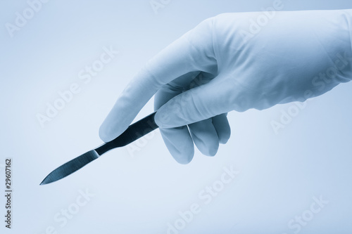 Canvas Print surgeon hand with scalpel during surgery