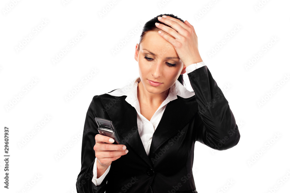 Depressed businesswoman with cellphone. Isolated Depressed businesswoman with cellphone. Isolated