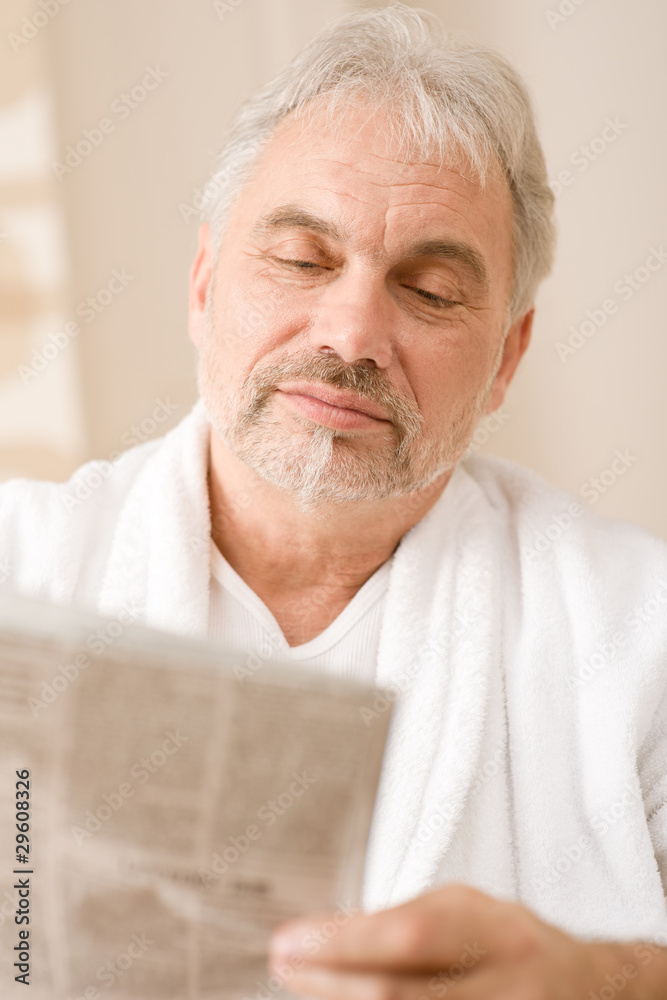 Senior mature man thoughtful read newspaper Senior mature man thoughtful read newspaper