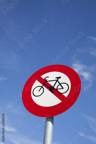 No bicycle sign with blue sky background.