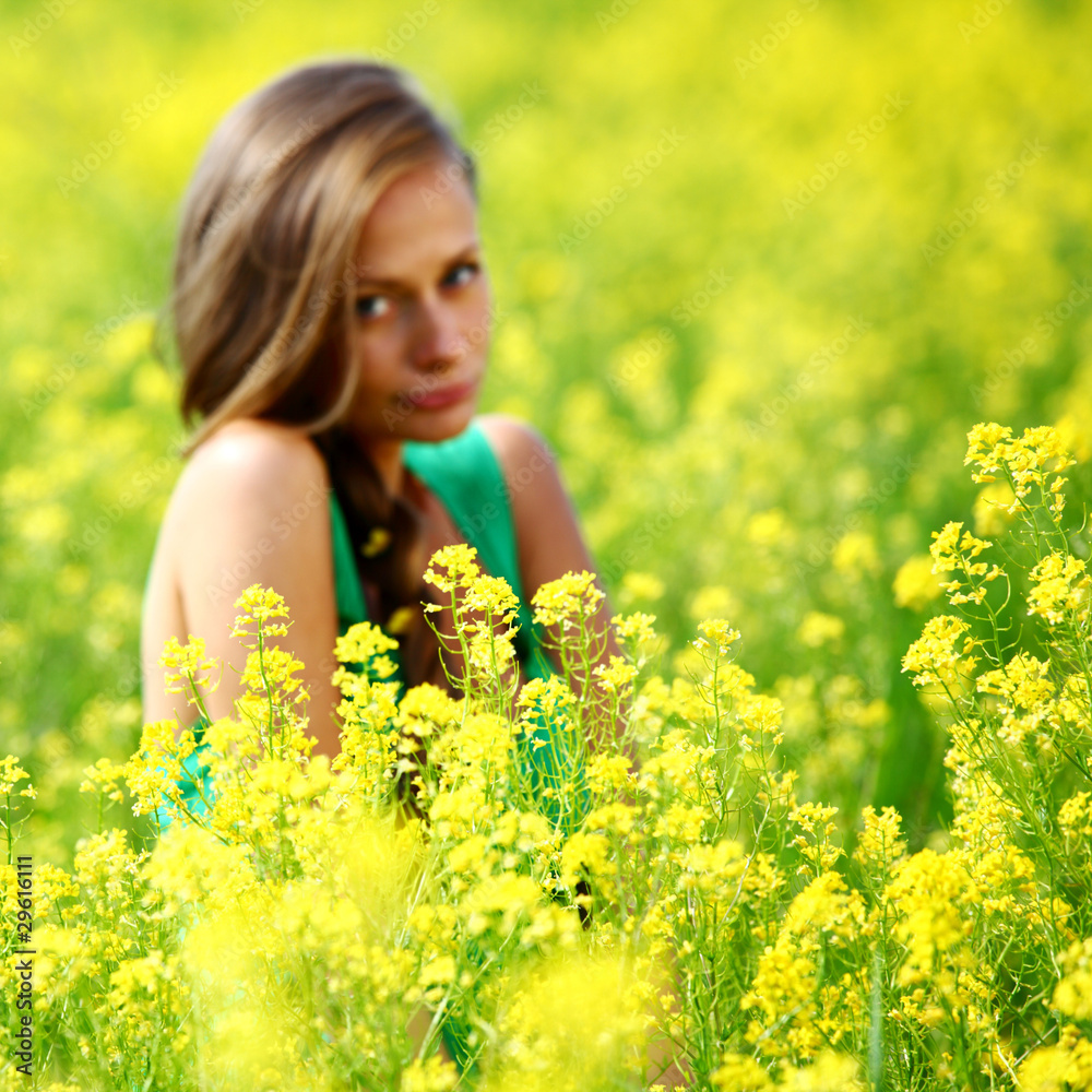 woman on oilseed field woman on oilseed field