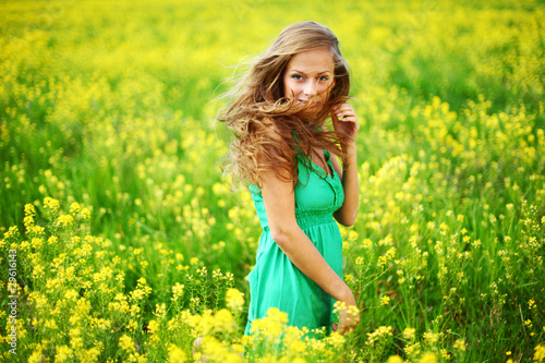 woman on oilseed field © yellowj