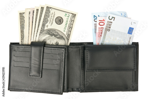 Dollars and euros in black leather wallet over white