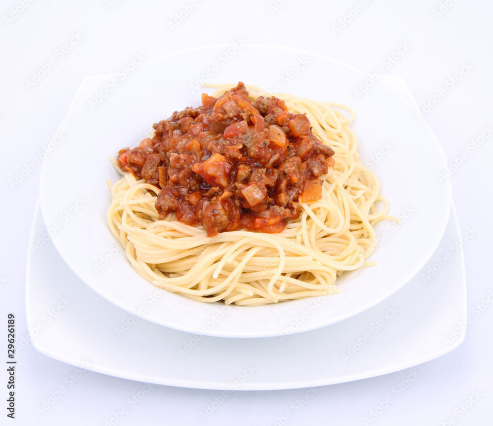 Spaghetti bolognese on a plate on a white background Spaghetti bolognese on a plate on a white background